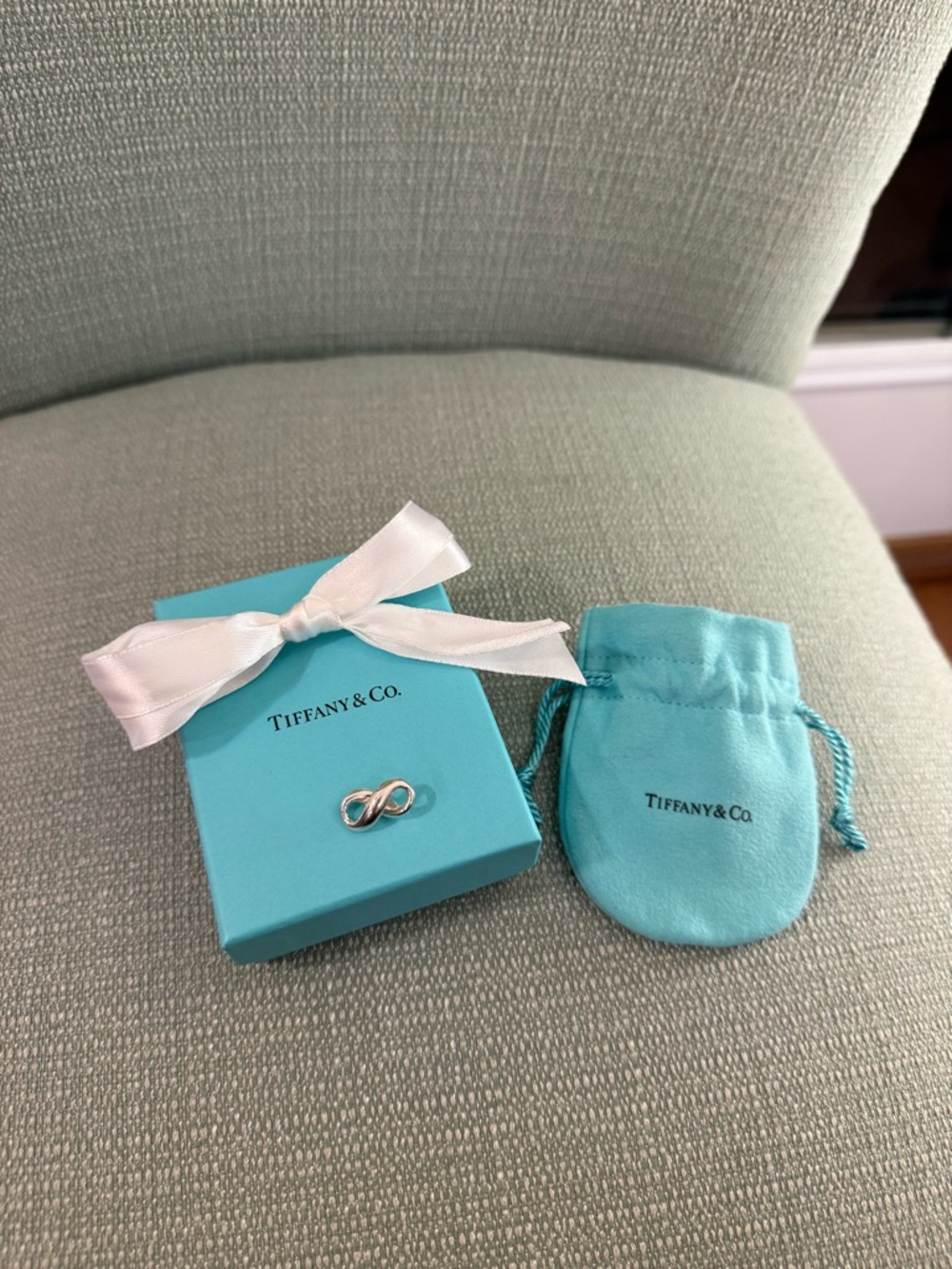 Tiffany & Co. Infinity Sterling Silver Charm with Signature Blue Box and Pouch